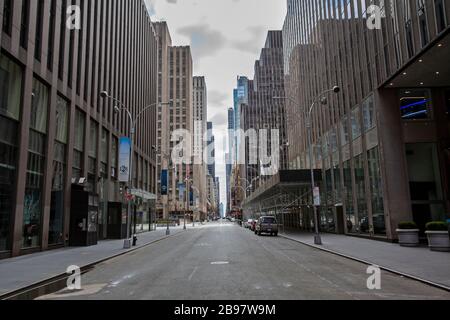Few automobiles travel on the empty streets in New York City because of COVID-19, Coronavirus. Stock Photo