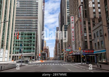 Few automobiles travel on the empty streets in New York City because of COVID-19, Coronavirus. Stock Photo