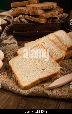 Slices of white bread and brown bread in box Stock Photo