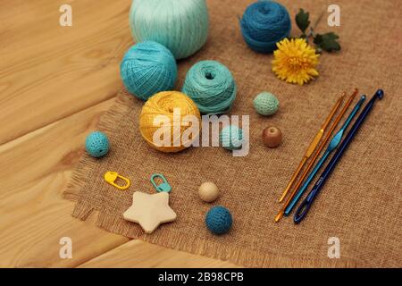 yellow and blue crochet yarn and hooks Stock Photo