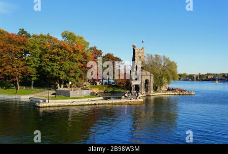 Alexandria Bay, New York, U.S.A - October 24, 2019 - The aerial view of the Alster Tower of Boldt Castle surrounded by striking fall foliage along St Stock Photo