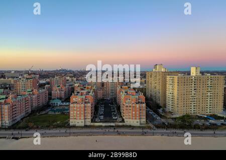 Sunset over Brighton Beach, Brooklyn looking at the Manhattan Skyline. Stock Photo