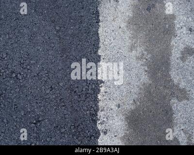 Asphalt road repair concept. The old gray and new dark grey road asphalt surfaces outdoors background Stock Photo