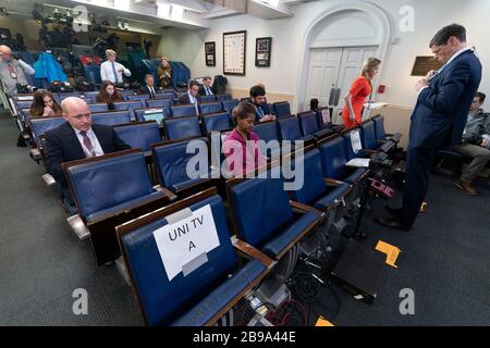 Washington DC, USA. 23rd Mar, 2020. Reporters take their places before a news briefing by members of the Coronavirus Task Force in the Brady Press Briefing Room at the White House in Washington, DC on Monday, March 23, 2020.Credit: Chris Kleponis/Pool via CNP /MediaPunch Credit: MediaPunch Inc/Alamy Live News Stock Photo
