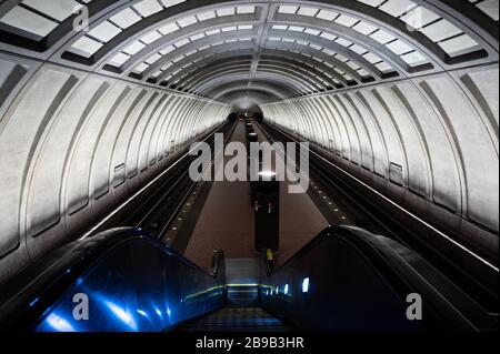 Washington, United States. 23rd Mar, 2020. Practically deserted morning rush hour Cleveland Park Metro station in Washington, DC. Credit: SOPA Images Limited/Alamy Live News Stock Photo