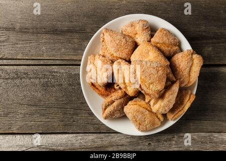 Cookies on a saucer on old wooden table Stock Photo
