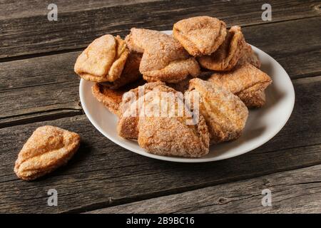 Cookies on a saucer on old wooden table Stock Photo