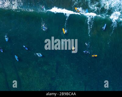 Aerial view of group of surfers, Bali, Indonesia Stock Photo