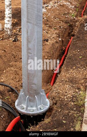 electric cable laying in underground trench. fiber optic cable for fast internet. Metal support construction. Stock Photo