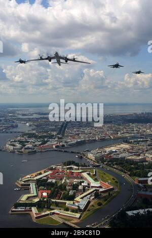 Tu-142MZ airplane with Su-33 jet fighters of the Russian Navy over Saint Petersburg, Russia. Stock Photo