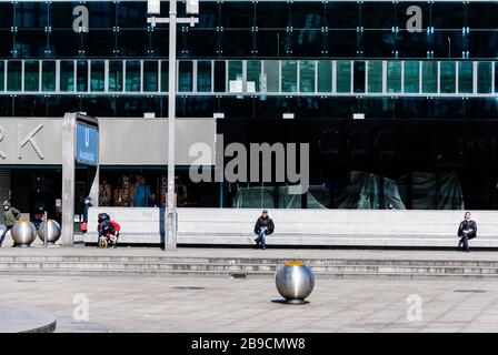 Berlin, Germany. 23rd Mar, 2020. People rest with distance on Alexanderplatz in Berlin, capital of Germany, March 23, 2020. The German government has approved the 'largest aid package' in the country's history to combat the coronavirus, the Ministry of Finance (BMF) announced on Monday. Credit: Binh Truong/Xinhua/Alamy Live News Stock Photo