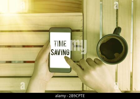 Handwriting text Time Saving. Conceptual photo the act of reducing the amount of time needed to do something Stock Photo