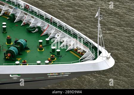 Close up of  section of ships bow and front deck  showing deck furniture on green background Stock Photo