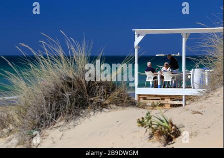 Mature Couple having Lunch on a beach in Spain. Stock Photo