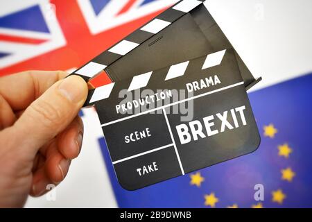 PHOTOMONTAGE, film flap with Brexit stroke, British flag and EU flag, FOTOMONTAGE, Filmklappe mit Brexit-Schriftzug, britische Flagge und EU-Fahne Stock Photo