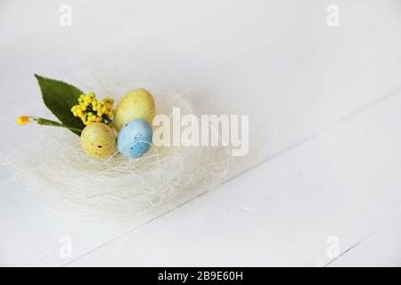 Congratulatory easter background. Easter eggs and flowers. Stock Photo