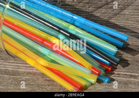 environmentally harmful drinking straws, lying plastic straw drink straws Stock Photo