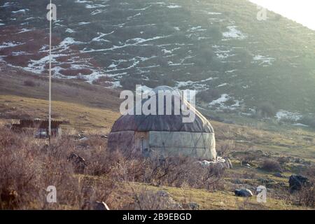 The ancient dwelling of the peoples of Asia is a yurt. In the mountains in winter. snow landscape Stock Photo