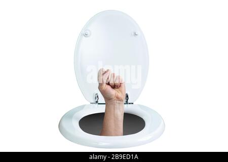 a hand with a clenched fist coming out of the toilet Stock Photo