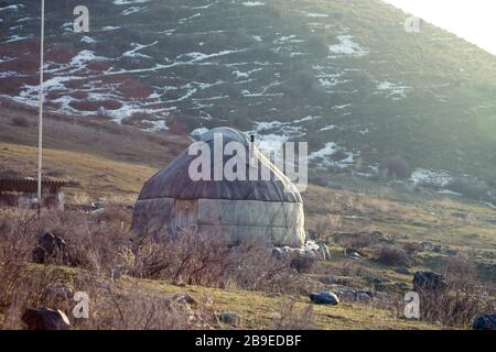 The ancient dwelling of the peoples of Asia is a yurt. In the mountains in winter. snow landscape Stock Photo