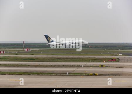 Shanghai, China - May 14, 2019: holding apron of Shanghai Pudong International Airport, An Airbus A380-800 operated by Singapore Airlines is landing. Stock Photo