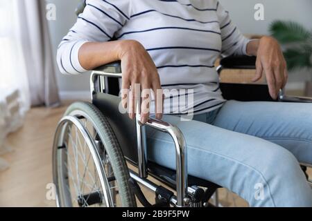 Disabled old lady sit in wheelchair in hospital or home Stock Photo