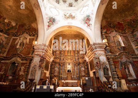 TUCSON, ARIZONA - APRIL 17, 2018: the main alter of Mission San Xavier del Bac. The mission was founded in 1692. Stock Photo
