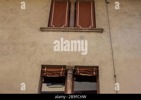 Brown blinds on the windows of a house in Verona, Italy Stock Photo