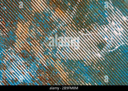 Peeling paint on rusty corrugated metal Stock Photo