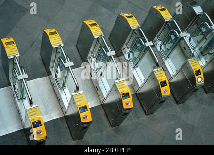 Acces gates where you can scan your card to get to the public transport facilities.