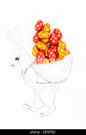 Hand drawn easter bunny carrying a huge backpack filled with real chocolate eggs wrapped in orange and red aluminum foil. Stock Photo