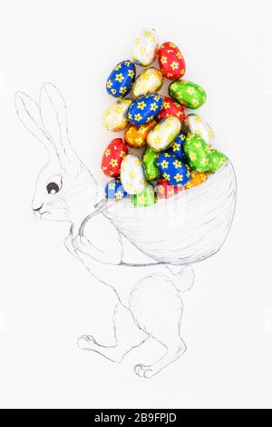 Hand drawn easter bunny carrying a huge backpack filled with real chocolate eggs wrapped in colorful aluminum foil. Stock Photo