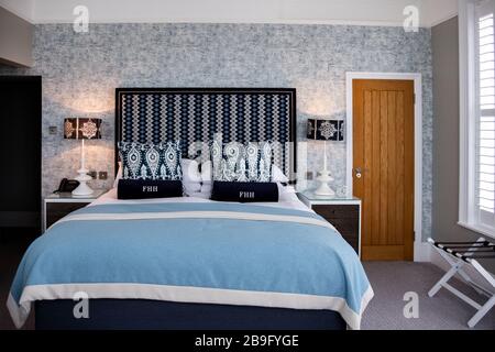 Beautiful hotel room of the Fowey Harbour Hotel decorated in tones of blue and white, some lines, some patterns for a feeling of bright, clean, luxury Stock Photo