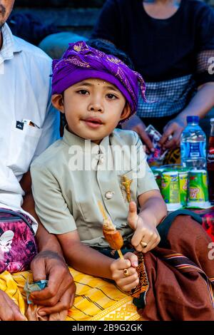 A Portrait Of A Balinese Hindu Boy During A Local Religious Festival, Ubud, Bali, Indonesia. Stock Photo