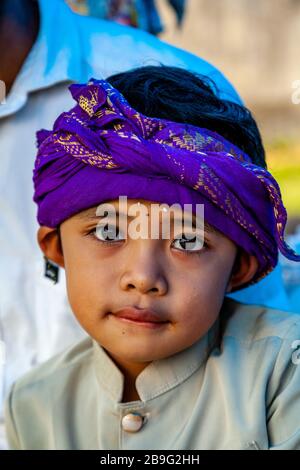 A Portrait Of A Balinese Hindu Boy During A Local Religious Festival, Ubud, Bali, Indonesia. Stock Photo