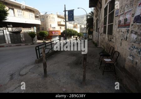 Palestine. 24th Mar, 2020. Photo taken on March 24, 2020 shows an empty street in the West Bank City of Nablus. Palestinian authorities on Sunday declared a 14-day lockdown on the West Bank as part of measures to combat the spread of coronavirus pandemic. The total number of Palestinians infected with COVID-19 has reached 60, with 58 in the West Bank and two in the Gaza Strip, a Palestinian official announced Tuesday. Credit: Ayman Nobani/Xinhua/Alamy Live News Stock Photo