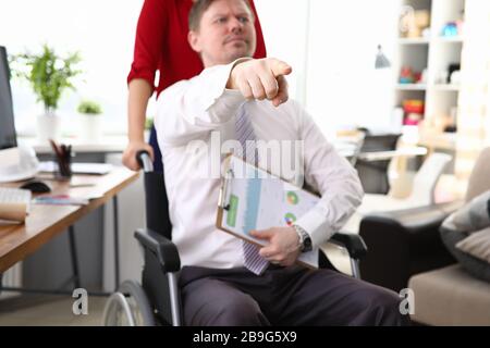 Woman in red blouse accompany man Stock Photo