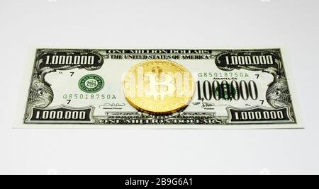 golden bitcoin lies on a one million dollar bill, white background, isolate Stock Photo