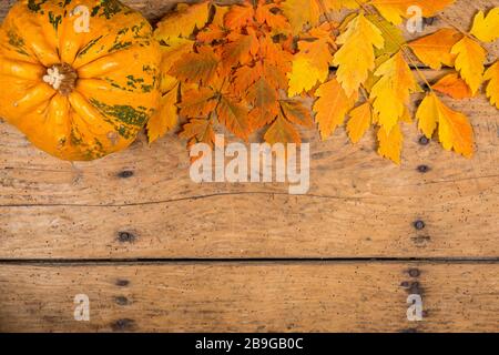 Helloween pumpkins over an old rustic vintage table - top view, copy space Stock Photo