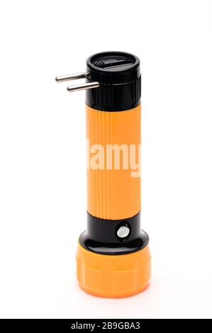 Yellow LED flashlight with the ability to recharge from the mains on an isolated white background Stock Photo