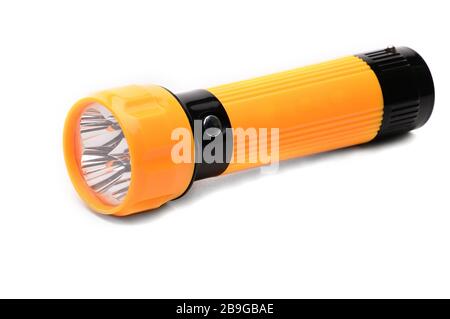 Yellow LED flashlight with the ability to recharge from the mains on an isolated white background Stock Photo