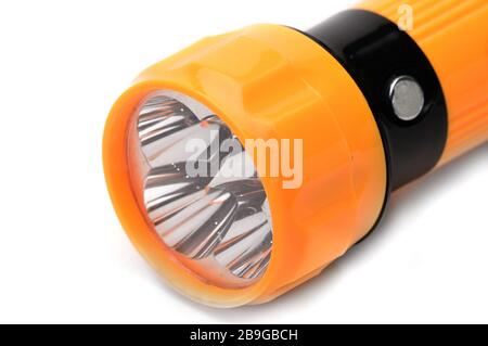 Yellow LED flashlight with the ability to recharge from the mains on an isolated white background Stock Photo
