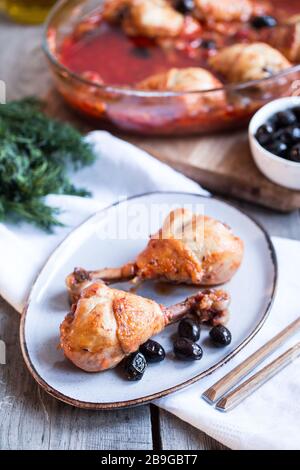 Chicken Cacciatore braised with wine, olives and tomatoes, traditional Italian dish Stock Photo