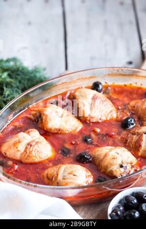 Chicken Cacciatore braised with wine, olives and tomatoes, traditional Italian dish Stock Photo