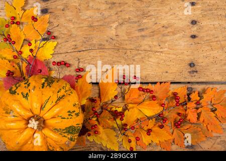 Helloween pumpkins over an old rustic vintage table - top view, copy space Stock Photo