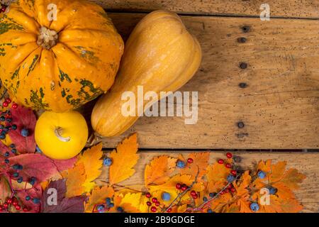 Helloween pumpkins over an old rustic vintage table - top view, copy space Stock Photo