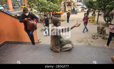 Gurgaon, India. 15th Mar, 2020. An old man seen spreading his hand out for money at metro station sikanderpur haryana.People across the globe are going through a novel disease called Corona-virus or Covid-19. Thousands of people are infected across the globe and thousand lost their lives. (Photo by Khurshid Ahanger/Pacific Press) Credit: Pacific Press Agency/Alamy Live News Stock Photo