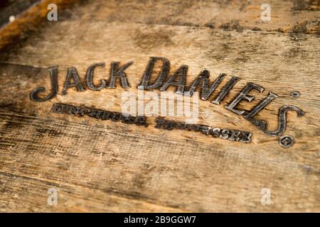 The brand name Jack Daniel's and Lynchburg Tennessee branded onto the top of an oak Whiskey Barrel Stock Photo