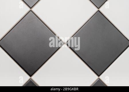 Bottom tiles in black and white laid out in a diamond pattern Stock Photo