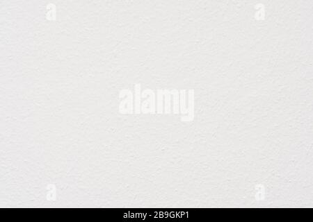 Ingrain wood chip wall paper painted white texture background Stock Photo